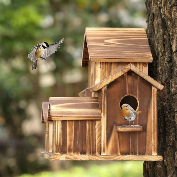 Small wooden bird house for outdoor garden display